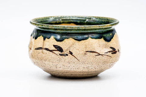 Another rotated view showing the green Oribe glaze and beige body