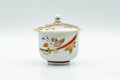 Japanese Teacup - Floral Kutani-yaki Ryuzan Lidded Yunomi - 60ml - front view of the white porcelain cup with its lid in place showing the colourful floral design