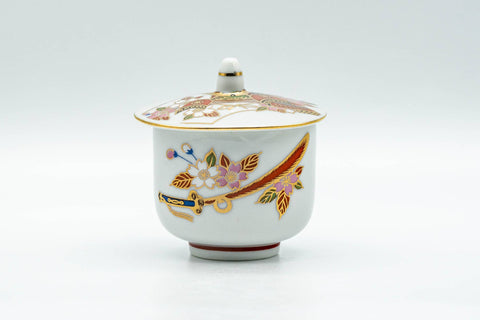 Japanese Teacup - Floral Kutani-yaki Ryuzan Lidded Yunomi - 60ml - front view of the white porcelain cup with its lid in place showing the colourful floral design