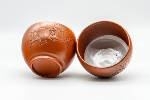 Japanese Teacups - Pair of Floral Engraved White Inner Glazed Tokoname-yaki Yunomi - 125ml - one cup tipped to show the white interior glaze