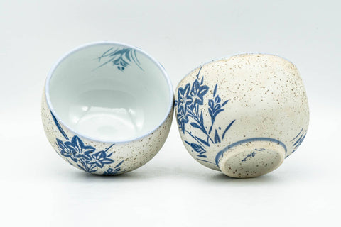 Tezumi — Japanese Teacups - Pair of Blue Floral Textured Arita-yaki Yunomi - 100ml — three-quarter view