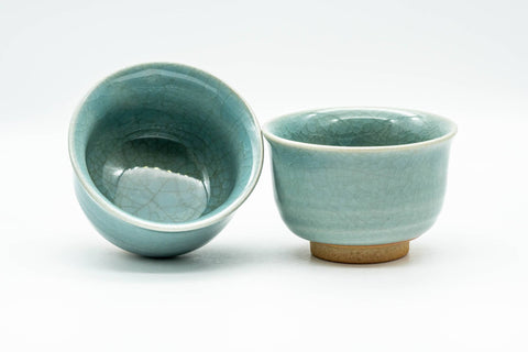 Japanese Teacups - Pair of Celadon Crazed Glazed Yunomi - 125ml - one cup tilted to reveal the crazed glaze inside, beside the second cup