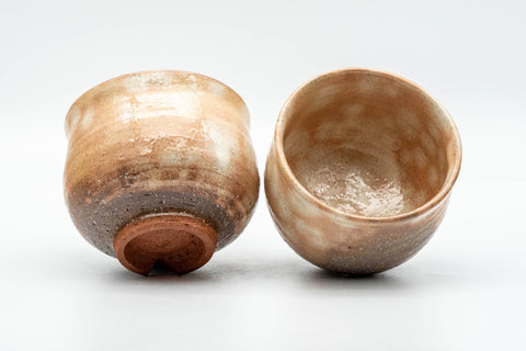 Tezumi — Japanese Teacups - Pair of Beige Brown Gohonte Hagi-yaki Yunomi - 180ml — three-quarter view