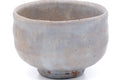Larger front view of the milky white Hagi chawan showing the rim.