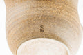 Underside of the katakuchi showing the pale clay foot.