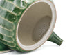 Green faceted Oribe Tokoname teapot, open view showing the pale interior and spout