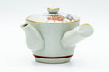 Side profile of the kyusu teapot with the side handle at left and the spout at right.