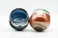 Tezumi — Japanese Teacups - Pair of Black and Red White Drip-Glazed Yunomi - 110ml — three-quarter view
