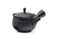 Spiraling benishibori Tokoname teapot, three-quarter view of the glossy black ribbed kyusu with side handle
