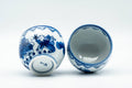 Japanese Teacups - Pair of Playful Villagers Arita-yaki Yunomi - 130ml - angled view of the pair with one cup showing its interior