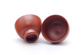 Tezumi — Japanese Teacups - Pair of Calligraphy Engraved Tokoname Red Shudei Yunomi - 80ml — front view from another angle