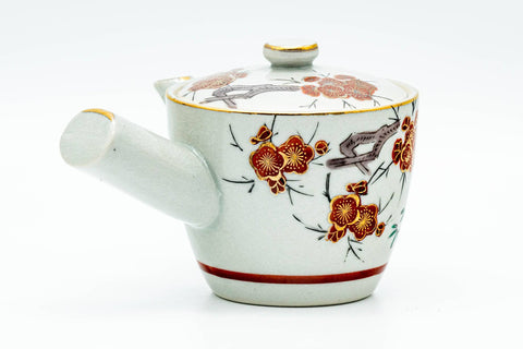 Opposite-side view of the kyusu showing more of the floral Kutani decoration.