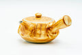 Three-quarter view of the yellow Arita-yaki teapot, side handle extending to the right