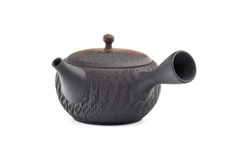 Black-and-red yōhen Tokoname kyusu teapot with side handle and dimpled tochiri texture - side view with the spout to the right