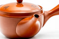 Close-up angled view of the spout and rounded red shudei body.
