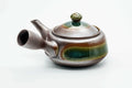Rear three-quarter view of the banko kyusu showing the handle and green glaze.