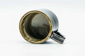 Looking down into the cup at its glazed interior, with the handle visible.