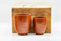 Japanese Teacups - Pair of Smooth Red Shudei Tokoname-yaki Meoto Yunomi with Wooden Box - the pair of teacups presented inside the wooden gift box