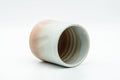 Tezumi — Japanese Teacup - Carved Beige Peach Glazed Hagi-yaki Yunomi - 200ml — three-quarter view