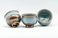 Japanese Teacups - Set of 3 Blue Turquoise Drip-Glazed Yunomi - 90ml - angled view of the set with one cup tilted
