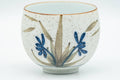 Tezumi — Japanese Teacup - White and Blue Floral Arita-yaki Yunomi - 140ml — tipped to show the interior
