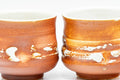 Tezumi — Japanese Teacups - Pair of Orange White Textured Glazed Yunomi - 100ml — top-down view of the interior
