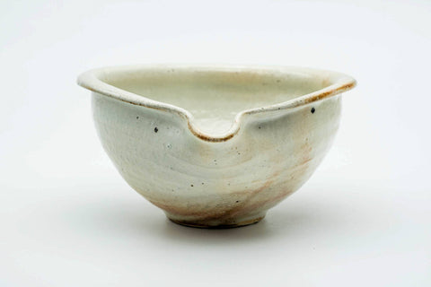Front view of the Shigaraki-yaki katakuchi showing its wide mouth and pinched spout.
