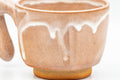Tezumi — Japanese Teacup - Beige White Drip-Glazed Hagi-yaki Ushirode Yunomi - 110ml — tipped to show the interior