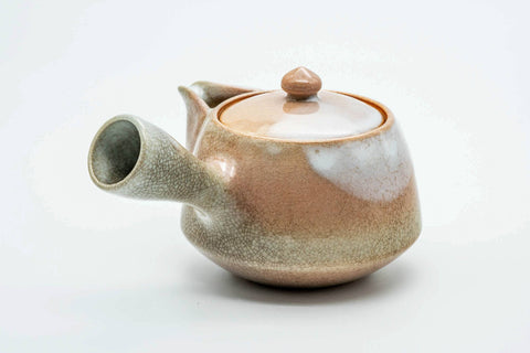 Beige-pink weathered Hagi-yaki kyusu, side profile with the spout to the left