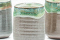 Tezumi — Japanese Teacup - Set of 3 Triangular-Shaped Green Drip-Glazed Yunomi - 90ml — top-down view of the interior