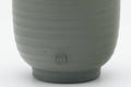 Tezumi — Japanese Teacup - Spiraling Green Ryokudei Tokoname-yaki Yunomi - 60ml — tipped to show the interior