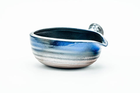 Front view from above showing the streaky blue-grey glaze and wide mouth.