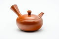 Three-quarter view from the spout side of the teapot.