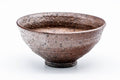 Three-quarter view of the brown tenmoku bowl, emphasising its widely flared rim.