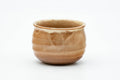 Front view of the cup body showing the horizontal ribbing and drip glaze.