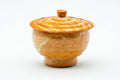 The lidded yunomi from another angle, lid on, showing the mottled Shino glaze.