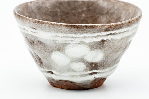Front close-up of one yunomi showing the glaze texture and speckling.