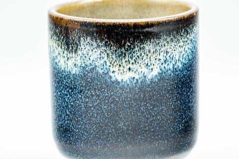 Tezumi — Japanese Teacup - Black and Blue Glazed Tsutsu-gata Yunomi - 140ml — tipped to show the interior