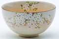 Close-up of the body highlighting the gold floral decoration.