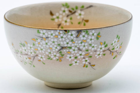 Close-up of the body highlighting the gold floral decoration.