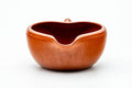 Front view from slightly above, showing the wide mouth and pinched pouring spout.