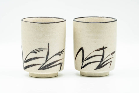 Japanese Teacups - Pair of Beige Long Grass Yunomi - 110ml - the pair of cups side by side, front view with the black long-grass brushwork