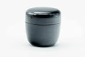 Small black-urushi ko-natsume matcha caddy, lid on, three-quarter view