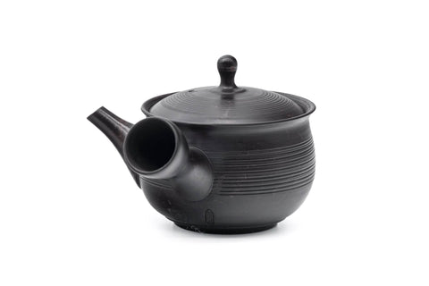 Spiraling benishibori Tokoname teapot, front view showing the spout