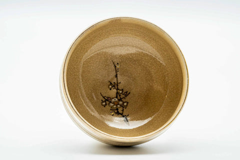Overhead view looking into the Kutani chawan, showing a small painted floral sprig inside