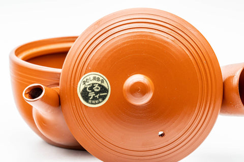 Japanese Kyusu - Spiraling Red Shudei Tokoname-yaki Mesh Teapot - 250ml - angled top view showing the concentric spiral ridges and the maker's stamp