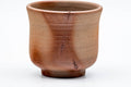 Tezumi — Japanese Teacup - Orange Hidasuki Rice Straw Bizen-yaki Yunomi - 115ml — tipped to show the interior