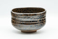Japanese Matcha Bowl - Brown and Yellow Glazed Waisted Chawan - 450ml - front view showing the brown and yellow spiraling glaze