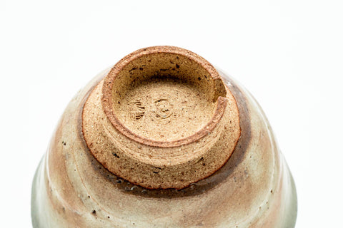 Inverted view of a cup showing the unglazed foot ring and base.