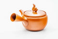 Red shudei Tokoname kyusu, three-quarter view with the spout to the right and handle to the left